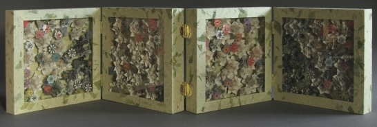 2009 One-of-a-kind altered book. One copy of The Plants (Life Nature Library1963), Thai mango leaf , mulberry, and Canson Mi-Teintes papers, foam core, book board, glass-headed steel pins, sheet acrylic, wooden frames, brass hinges 25.5 x 25.5 x 17.75 cm (closed) variable when open